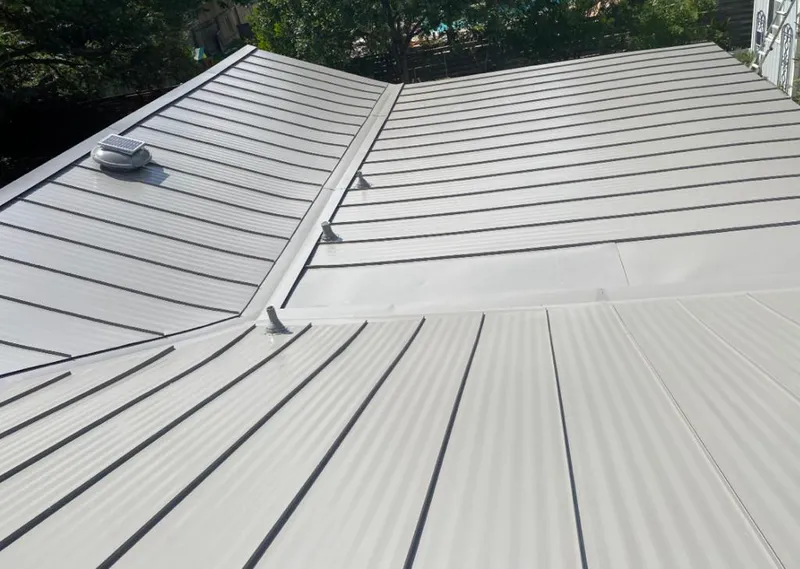 Solar attic fan installed on a metal roof for Roof Ventilation in Mount Zion